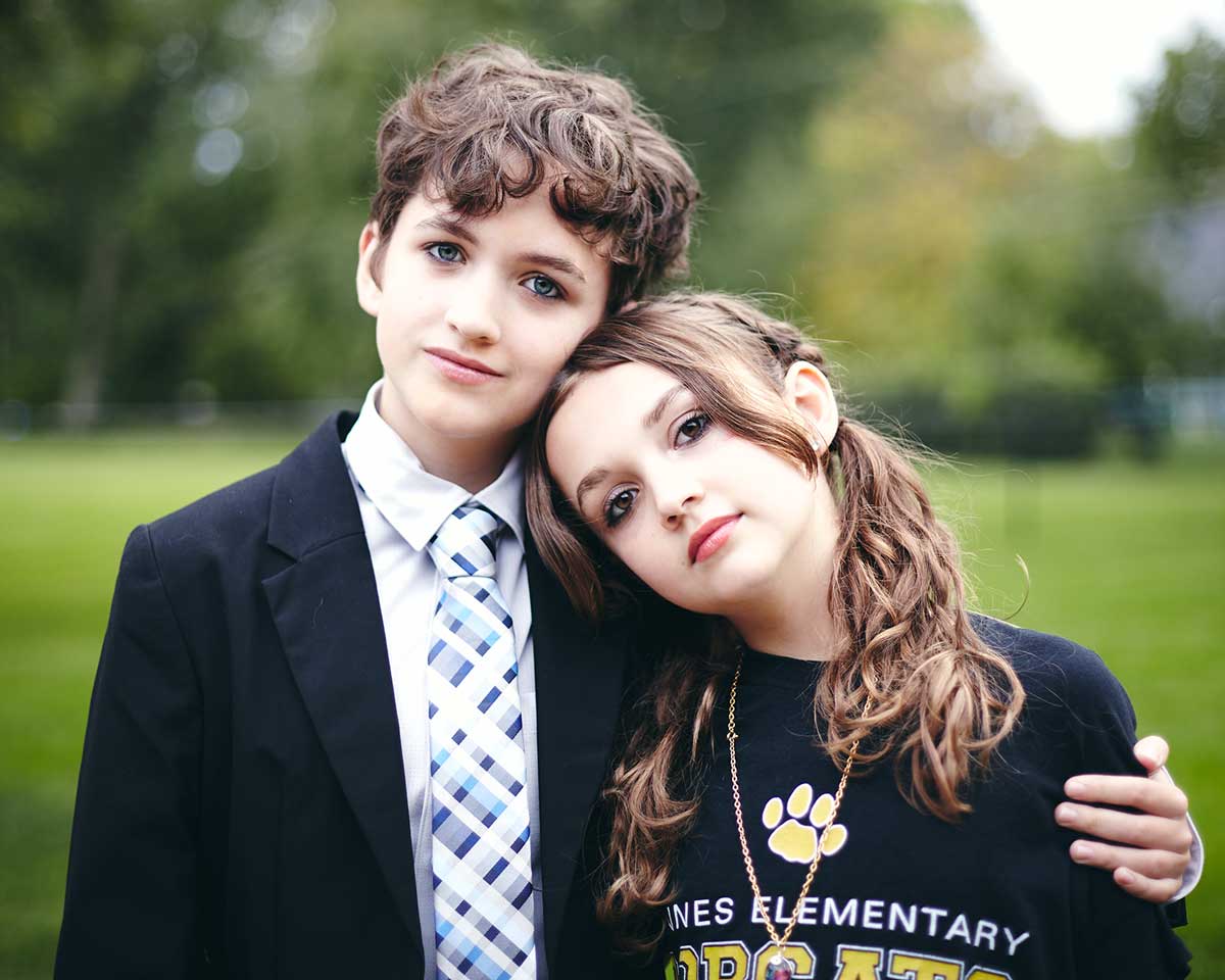 Portrait of siblings embracing each other