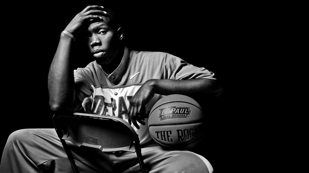 Dramatically lit black and white portrait of DePaul University basketball star